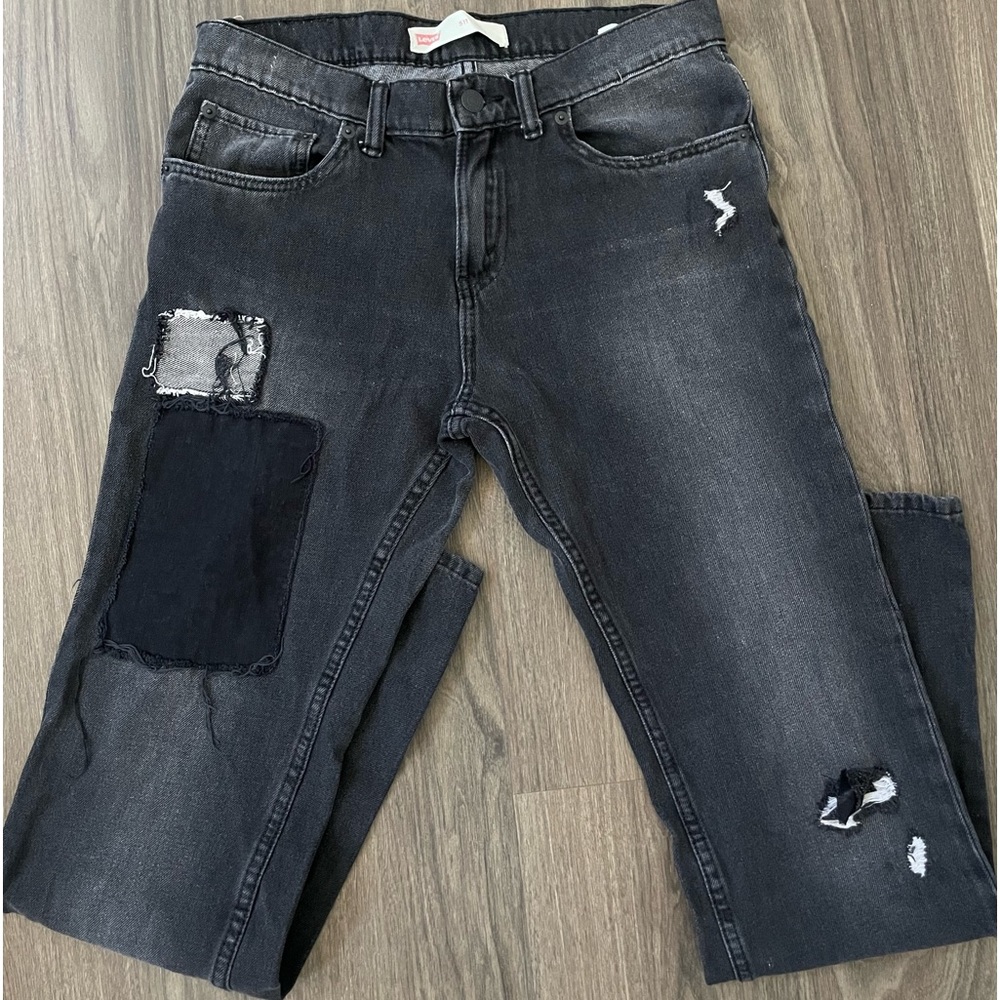 Levi’s patched black jeans